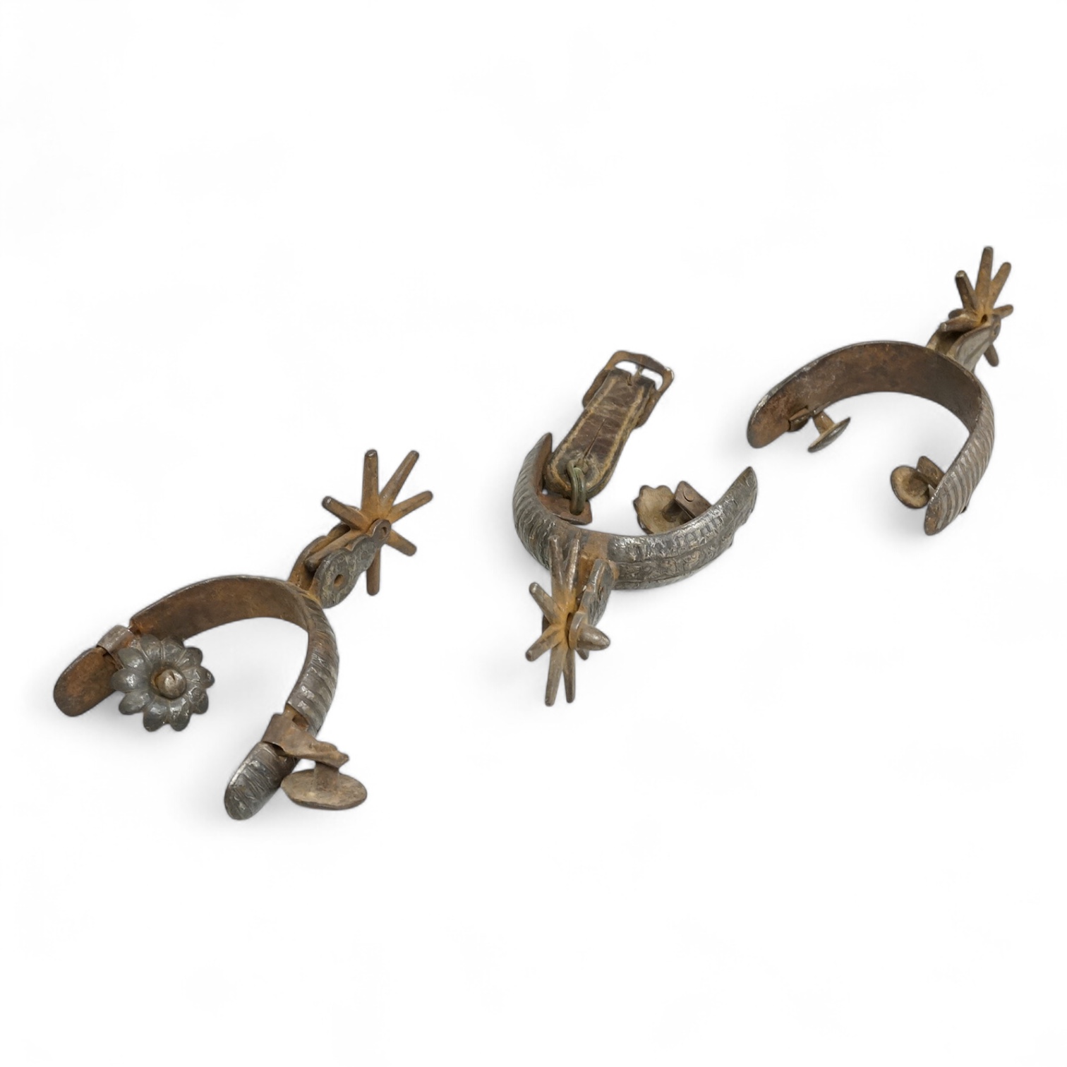 Three Spanish Colonial niello work and iron spurs, 14cm long